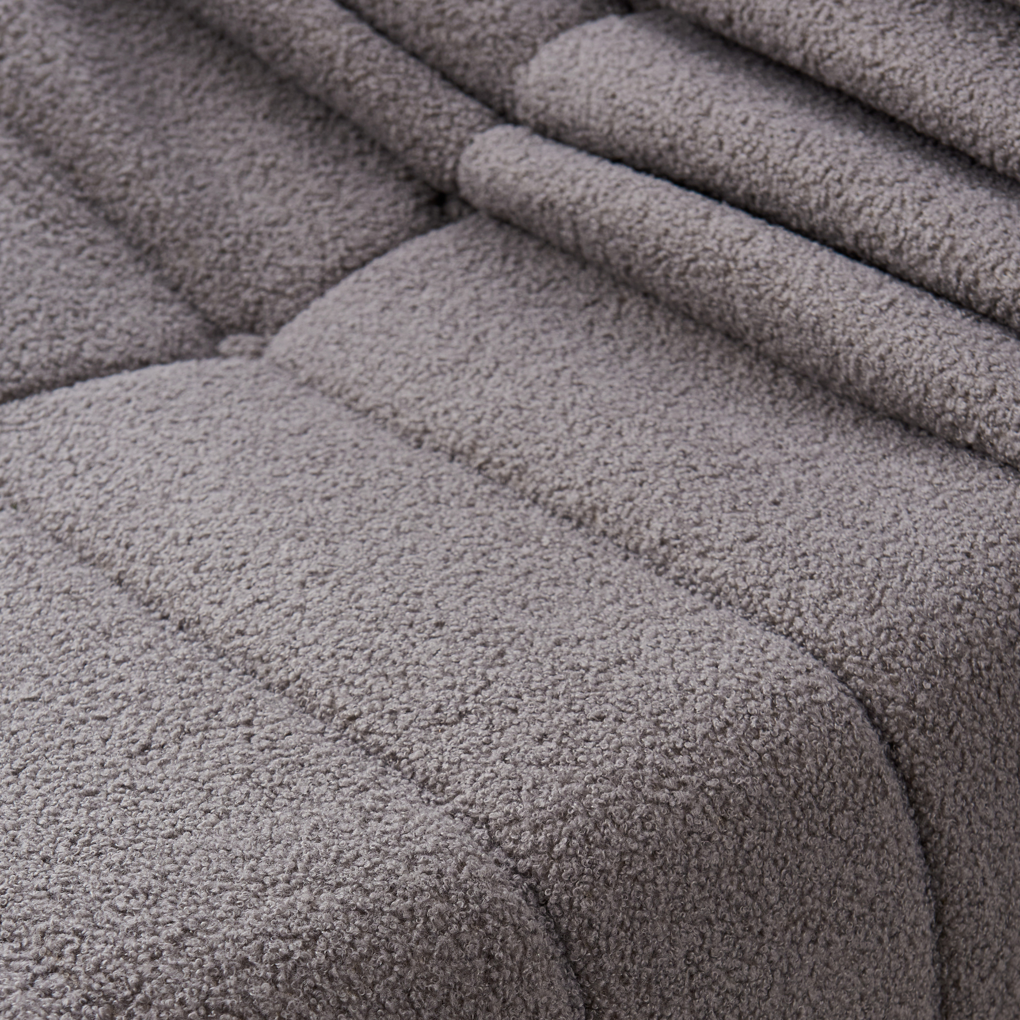 Close- up view of Lola single sofa in slate grey.