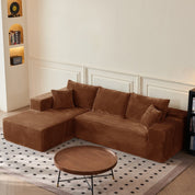 Brown sectional sofa in a living room with a round wooden coffee table.