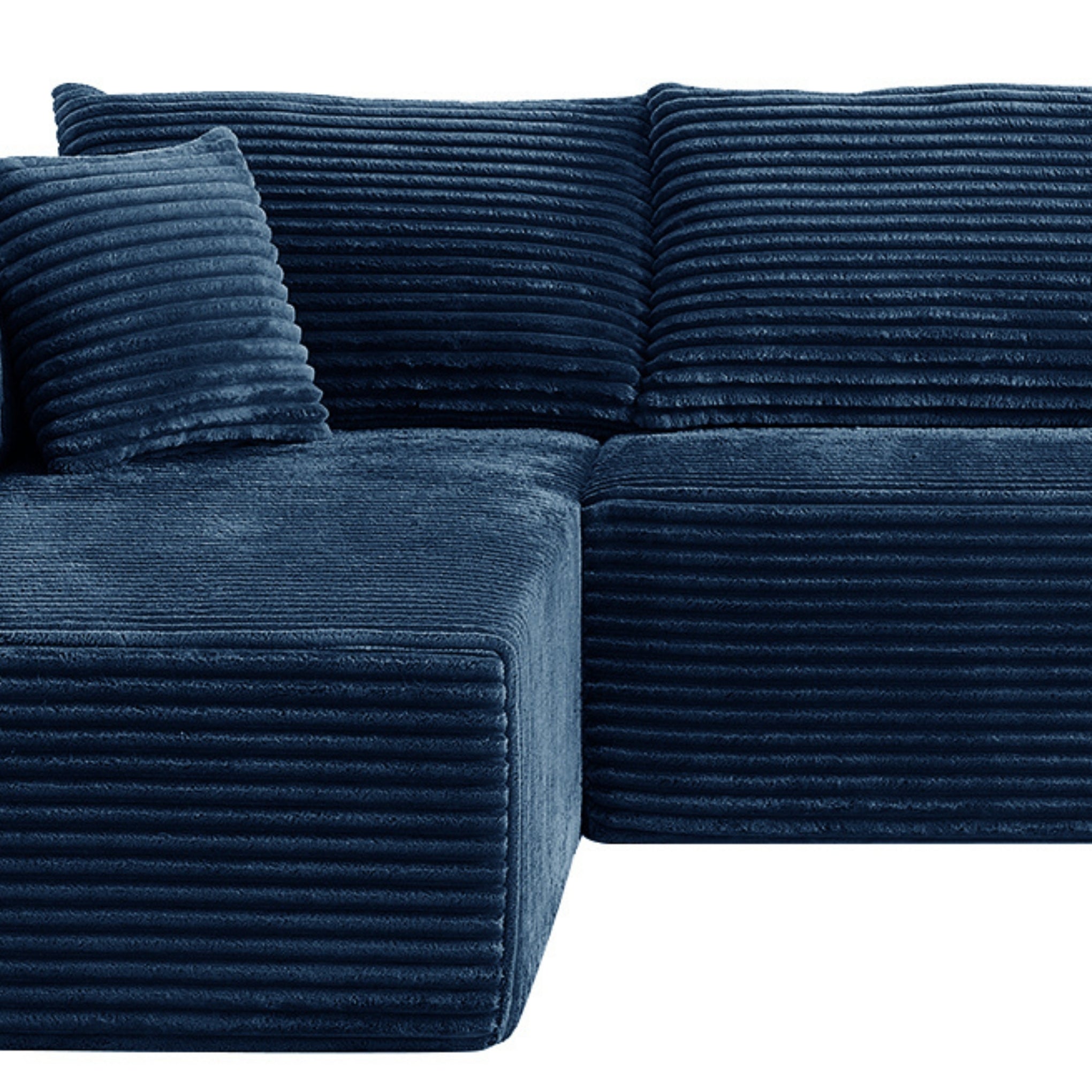 Blue textured sectional sofa with cushions on a white background