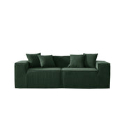 Green sofa with four cushions on a white background