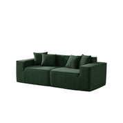 Green sofa with cushions on a white background
