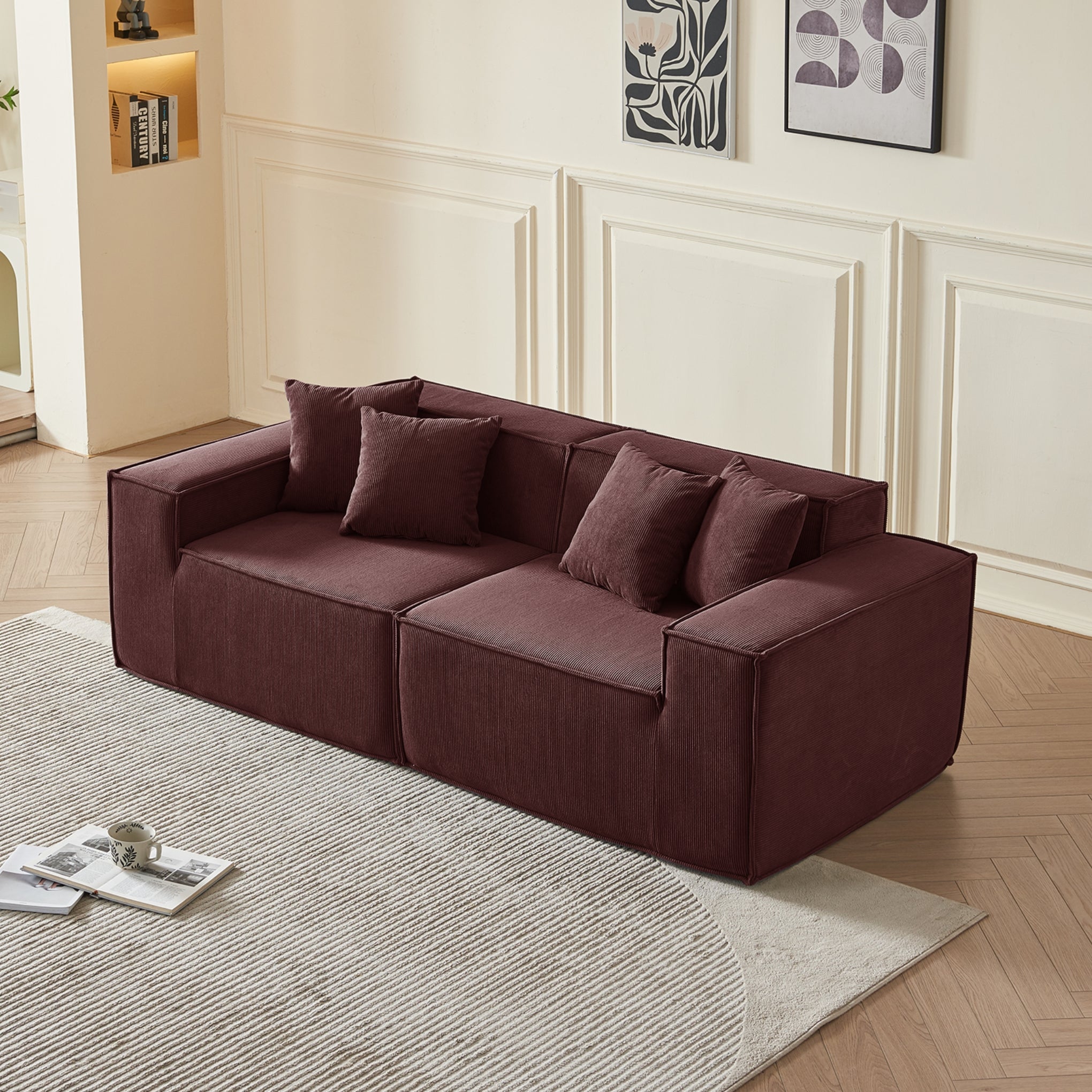 Brown sectional sofa in a living room with decorative pillows and a rug.
