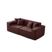 Brown sofa with four cushions on a white background